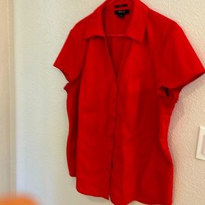 This women’s top is gently worn and machine washable